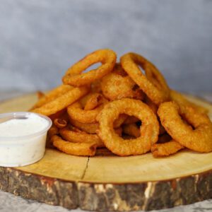 Onion Rings with a dip on a tray