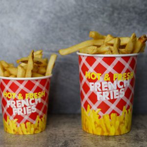 a small and big basket of French Fries