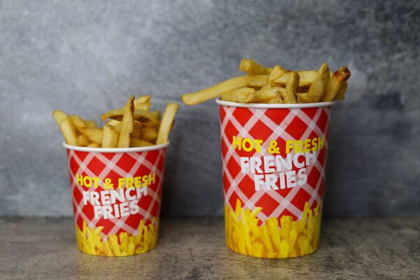 a small and big basket of French Fries