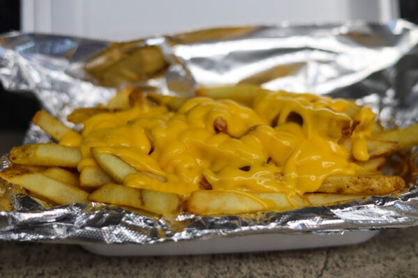 closeup shot of delicious Cheese Fries